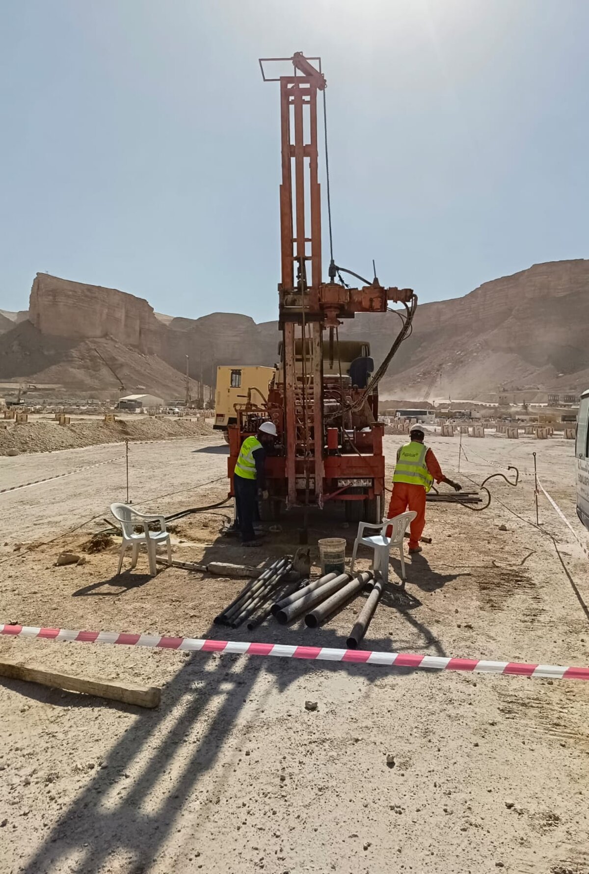 Saq Al-Ard drilling crew operating a water well drilling rig in the Riyadh desert